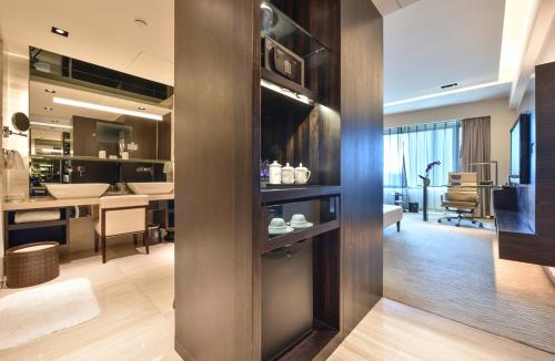 a room with a kitchen and a living room at Furama Hotel Dalian in Dalian