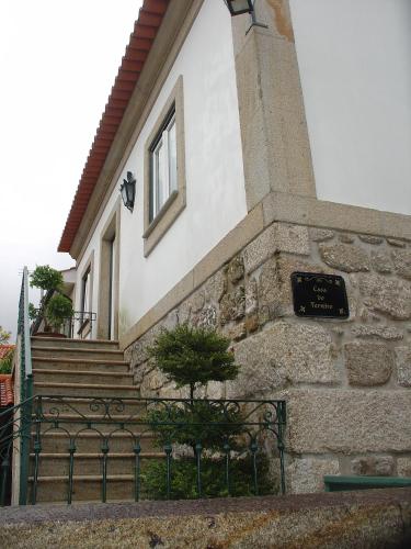 a building with a sign on the side of it at Casa do Terreiro in Beiral do Lima