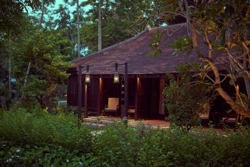 a cabin in the middle of a forest at Ancient Huế Garden Houses in Hue
