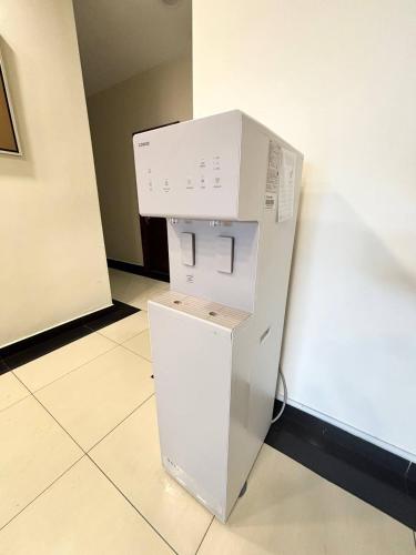 a box on top of a refrigerator in a room at Signature Hotel by Easy Nap in Puchong