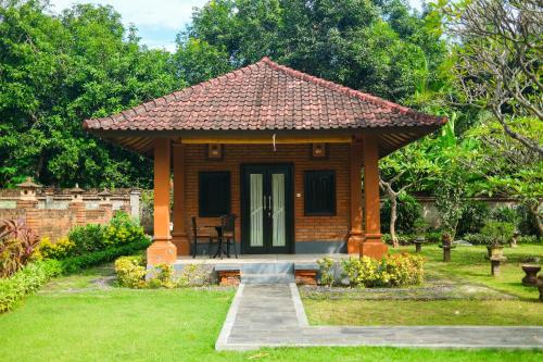 Κήπος έξω από το Badini Homestay Pemuteran Bali