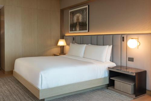 a large white bed in a hotel room at InterContinental Hotels Real Lima Miraflores by IHG in Lima