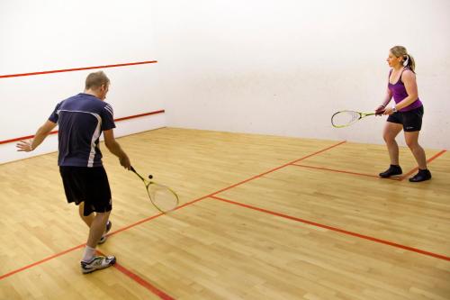 a man and a woman playing a game of tennis at Worriken in Butgenbach