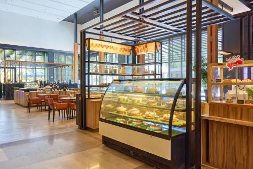 a display case in a restaurant with food in it at Midori Clark Hotel and Casino in Clark