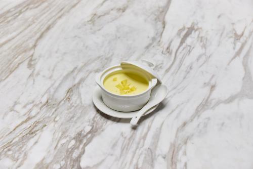 a cup of soup on a white marble table at Midori Clark Hotel and Casino in Clark