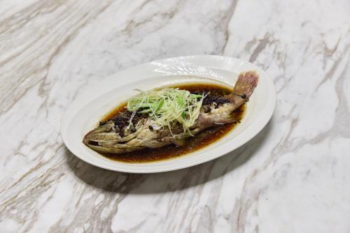 a white plate of food on a table at Midori Clark Hotel and Casino in Clark