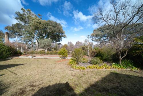 a large yard with trees and a park at Campbell Green Door Entry Suite in Campbell