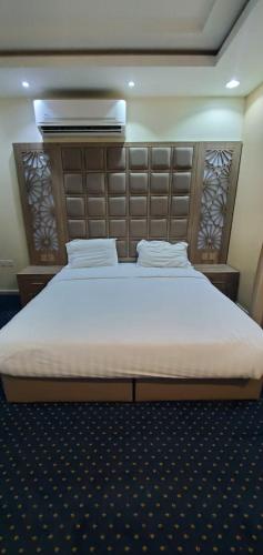 Letto o letti in una camera di شاليهات وشقق ليالي رهيف