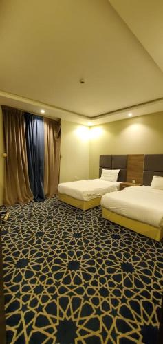 Letto o letti in una camera di شاليهات وشقق ليالي رهيف