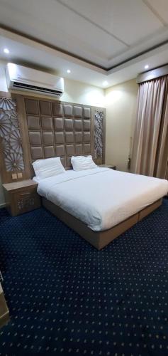 Letto o letti in una camera di شاليهات وشقق ليالي رهيف
