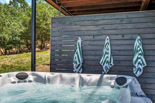 a hot tub in front of a wooden wall at Luxury Modern Home with Views - 3 Acres, 4000 Sq Ft in Sonoma