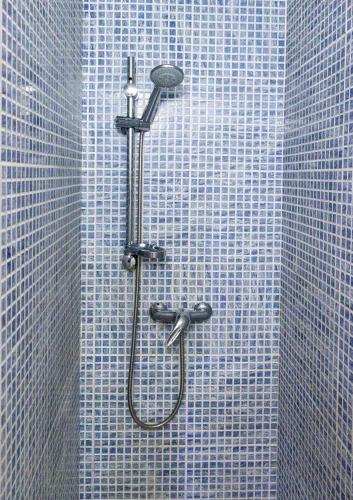 a shower in a bathroom with blue tiles at Casa Naxxar 4 Floor Townhouse and Private Pool in Naxxar