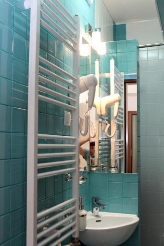 a bathroom with a sink and a mirror at Apartament Lucretia - Centrul Sibiului in Sibiu