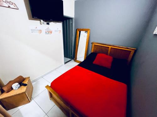 Postel nebo postele na pokoji v ubytování Hotel El Progreso - Económico, Central y Familiar en Armenia