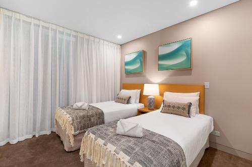 Una cama o camas en una habitación de Mirage Whitsundays