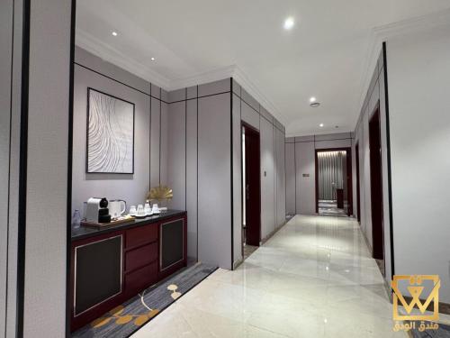 a hallway of a building with a hallway at Alwadaq Hotel in Taif