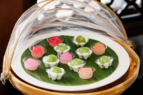 a plate of chocolates on a banana leaf at Rimping Village in Chiang Mai