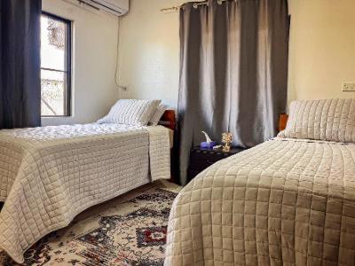 Postel nebo postele na pokoji v ubytování Majestic Nest Nadi B&B