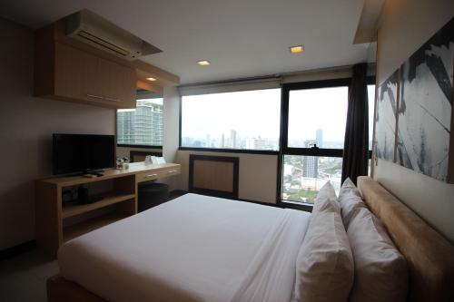 Una cama o camas en una habitación de BSA Twin Towers