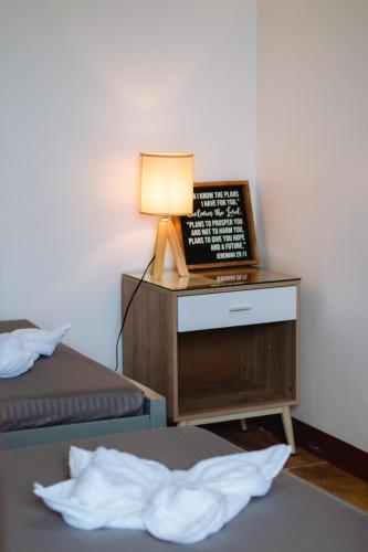 Una cama o camas en una habitación de GPC Guesthouse