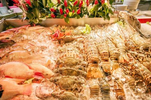 a display of different types of meats and seafood at Phi Phi Banyan Villa in Phi Phi Don