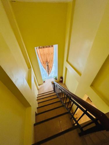 a stairway with a window and a curtain at Sheridan Villas Boracay in Boracay