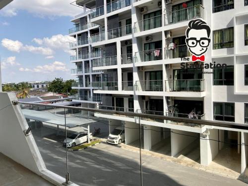 a apartment building with a sign on the side of it at Staycation Homestay 14 P Residence kuching condo in Kuching