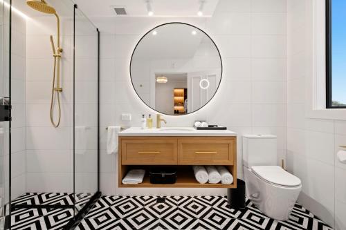 a bathroom with a sink and a mirror at The Clements Hotel in Cambridge