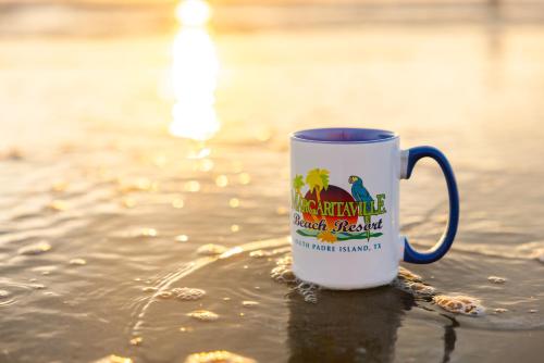a coffee cup sitting in the water in the water at Margaritaville Beach Resort South Padre Island in South Padre Island