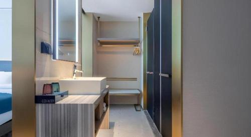 Ένα ή περισσότερα κρεβάτια σε δωμάτιο στο Echarm Hotel Zhuzhou Liling