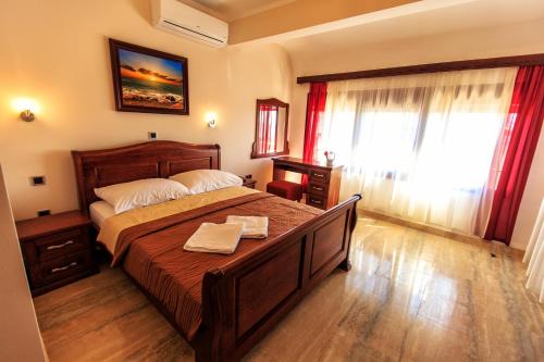 A bed or beds in a room at Compass Aparthotel