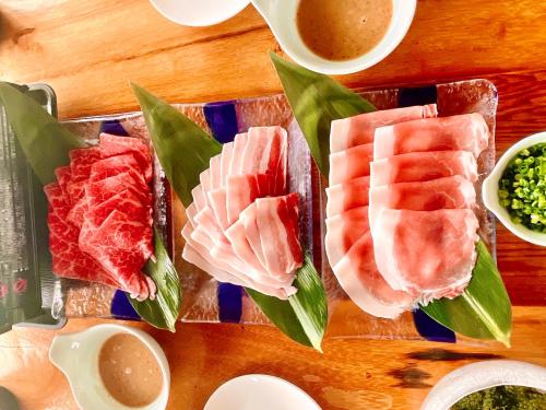 a tray of different types of food on a table at Haruhoo Resort ISHIGAKI in Ishigaki Island