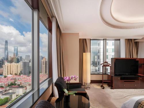 a hotel room with a view of a city at Grand Soluxe Zhongyou Hotel in Shanghai