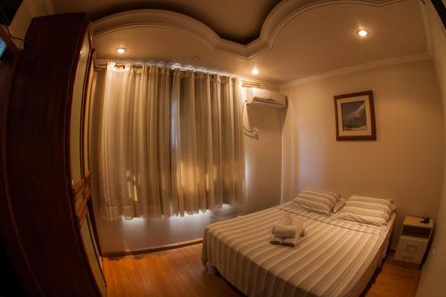 
Cama ou camas em um quarto em Pousada Baía dos Corais

