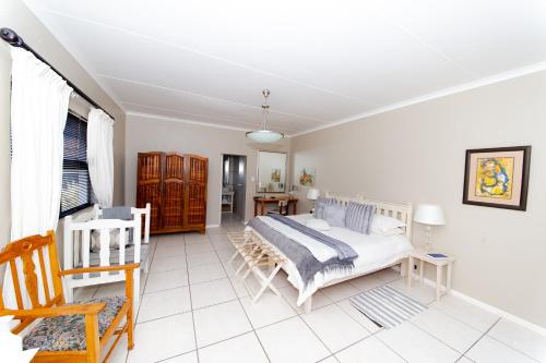 Ένα ή περισσότερα κρεβάτια σε δωμάτιο στο The Olive Tree Guest House