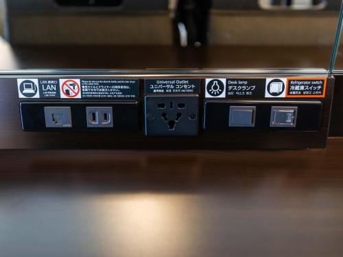 a close up of a electronic device on a table at APA Hotel Tottori Ekimae in Tottori