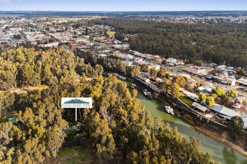 an aerial view of a city with a bridge and a river at The Treehouse in Moama