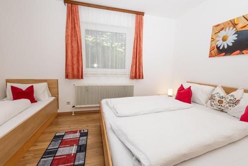 a bedroom with two beds and a window at Ferienhaus Panorama in Mutters