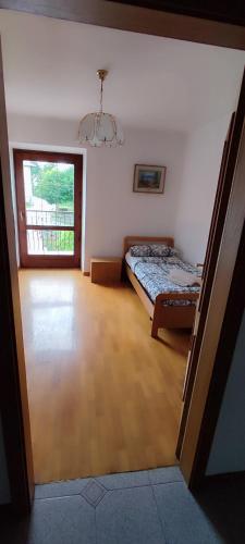a bedroom with a bed and a window in it at Casa Ianes in Ronzone