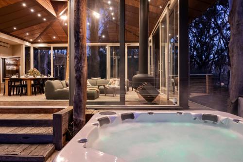 a jacuzzi tub in the middle of a house at The Treehouse in Moama