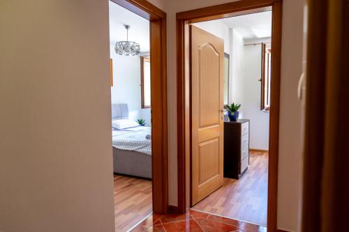 a hallway with a door leading to a bedroom at GRADINA - Stan na dan in Doboj