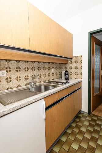 a kitchen with a sink and a counter top at Ferienhaus Panorama in Mutters