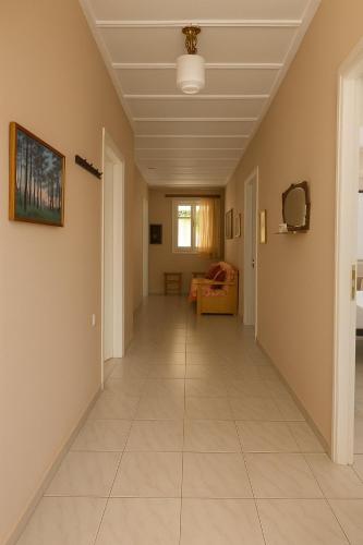 a corridor of a house with a hallway at Traditional Family House in Grizáta
