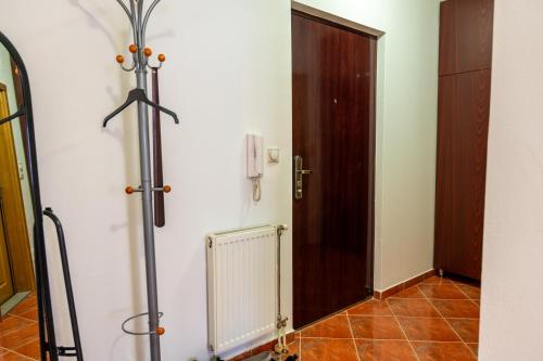 a room with a door and a tile floor at GRADINA - Stan na dan in Doboj