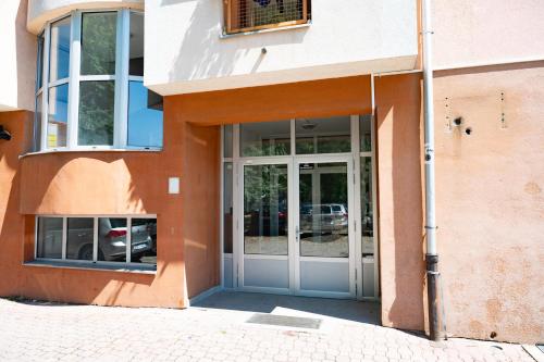 an entrance to a building with a glass door at GRADINA - Stan na dan in Doboj