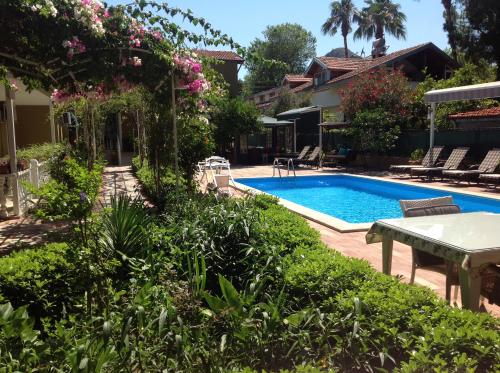 a swimming pool in the yard of a house at Berg Hotel in Dalyan