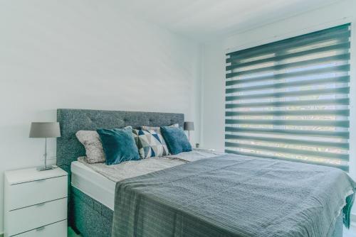 Ένα ή περισσότερα κρεβάτια σε δωμάτιο στο Sunny Beach Penthouse in Horadada