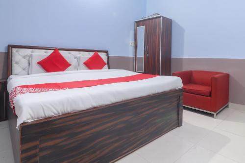 Ένα ή περισσότερα κρεβάτια σε δωμάτιο στο Hotel O Santoshi Guest House