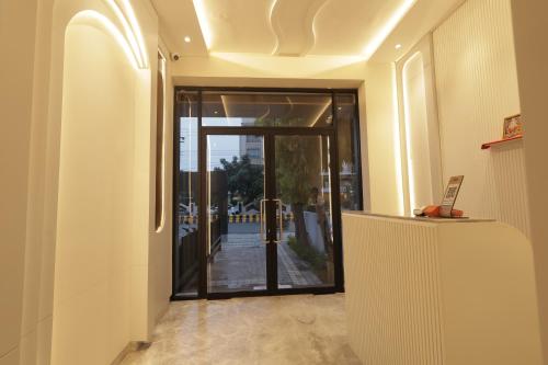 an entrance to a building with a glass door at Lakefront Hotel by Brijwasi in Mathura