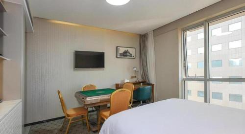 TV o dispositivi per l'intrattenimento presso Shanghai Bund South China Harbour View Hotel